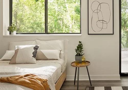 black-sliding-window-neutral-bedroom